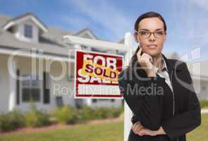 Mixed Race Woman in Front of House and Sold Sign