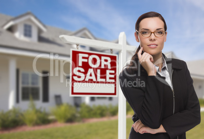 Young Woman in Front of House and Sale Sign