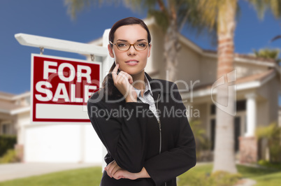 Young Woman in Front of House and Sale Sign