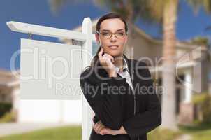 Woman In Front Of House and Blank Real Estate Sign