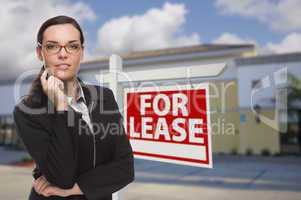 Woman In Front of Commercial Building and For Lease Sign