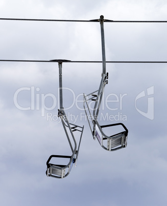 Chair-lifts and overcast sky