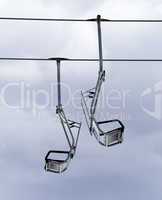 Chair-lifts and overcast sky