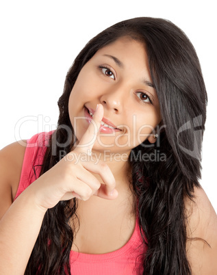 young woman with finger on her lips