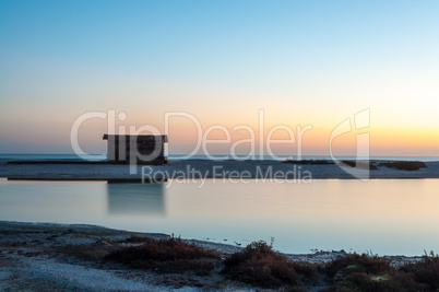 Cottage by the sea at dawn