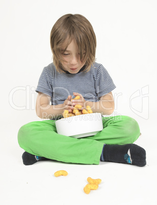 Boy with bowl full of peanut flips