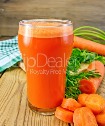 Juice carrot with napkin on board