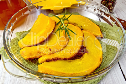Pumpkin baked in glass pan on board
