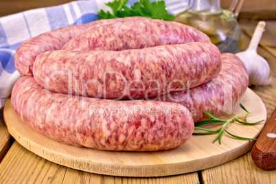 Sausages pork on board with oil