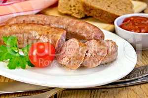 Sausages pork fried in plate on board with bread