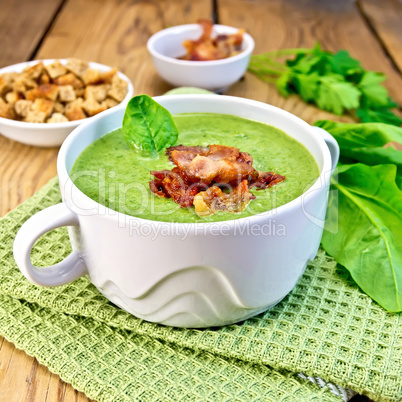 Soup puree with bacon and croutons on board