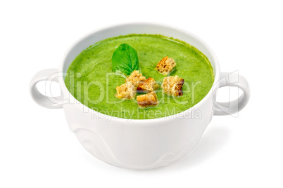 Soup puree with croutons and spinach in bowl