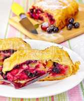 Strudel with black currants on the tablecloth
