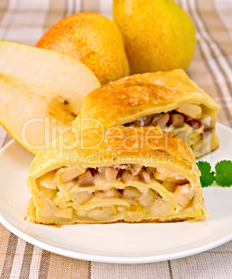 Strudel with pears on linen tablecloth
