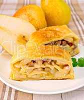 Strudel with pears on linen tablecloth