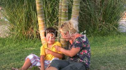 Mother and son relaxing time in park