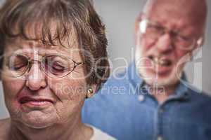 Battered and Scared Woman with Ominous Man Behind