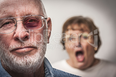 Battered and Scared Man with Screaming Woman Behind