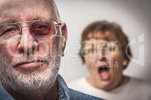 Battered and Scared Man with Screaming Woman Behind