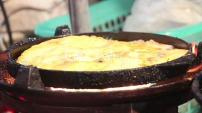 banana pancake cooking in night thai market