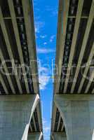 Between pair of concrete bridges on sky