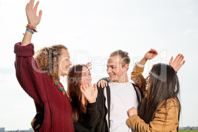 Group of young people at the waving