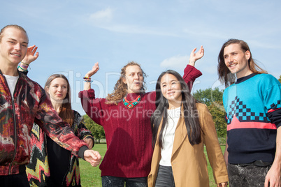 Waving group of young people