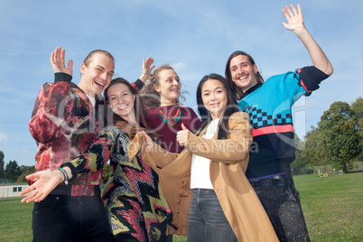 Waving group of young people