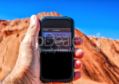 Man with GPS searching the right path in Australia