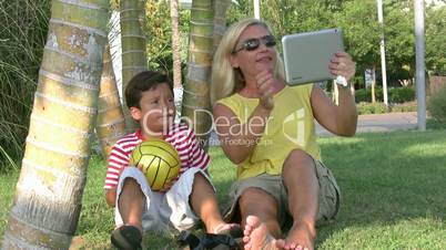 Mother and son sitting in the park