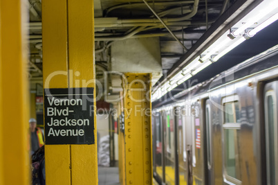 New York - Queens subway station with train stopping