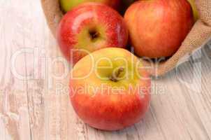 Fresh apples on a wooden table