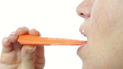 Female Eats Healthy Carrot Closeup