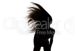 Silhouette of girl with waving hair