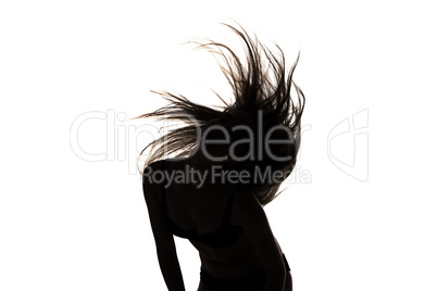 Silhouette of girl with long waving hair