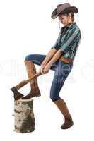 Image of young woman chops wood in profil