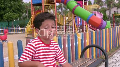 Sad child in the playground
