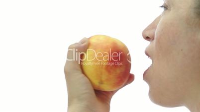 Female Eating Peach Side View