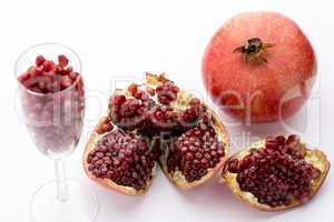 Pomegranate, whole and broken-up.