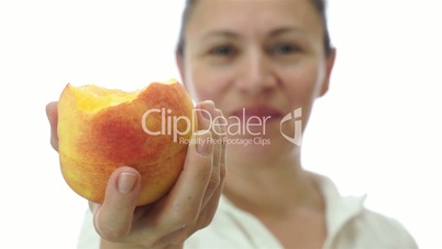 Woman Offering a Bite of Her Peach