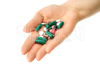 hand with pills isolated on white background