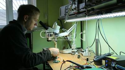 Scientist in laboratory parses the device