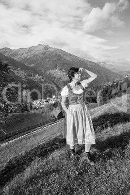 Woman in Dirndl in the mountains