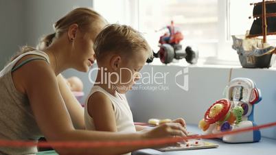 Mother and son playing learning game
