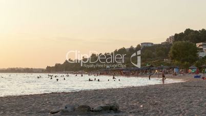 Timelapse of day at resort with people on beach