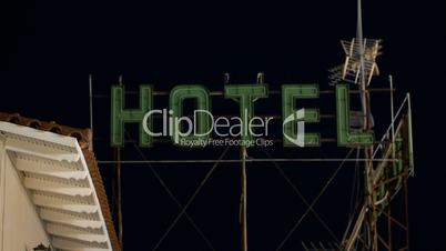 Timelapse of hotel banner blinking at night