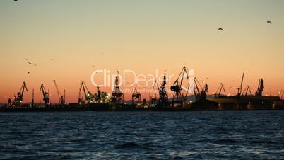 Dock with cranes in the evening