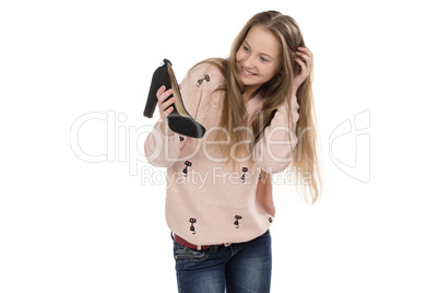 Portrait of teenage girl with the shoe