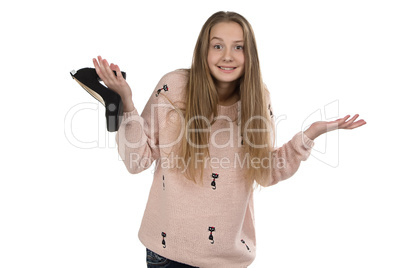 Photo of confused teenage girl with the shoe