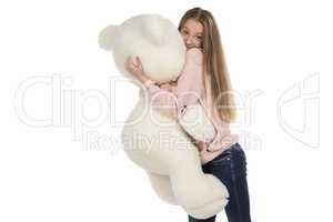 Photo of teenage girl hugging teddy bear
